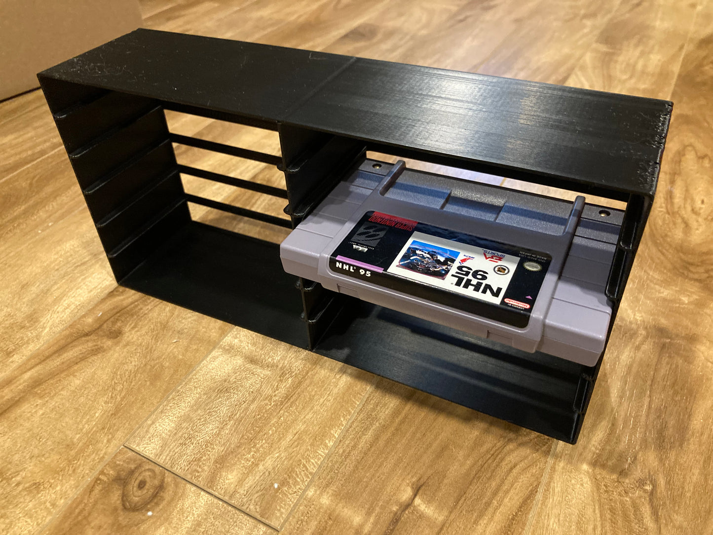 SNES rack display - Holds 12 games - Black color - Perfect condition