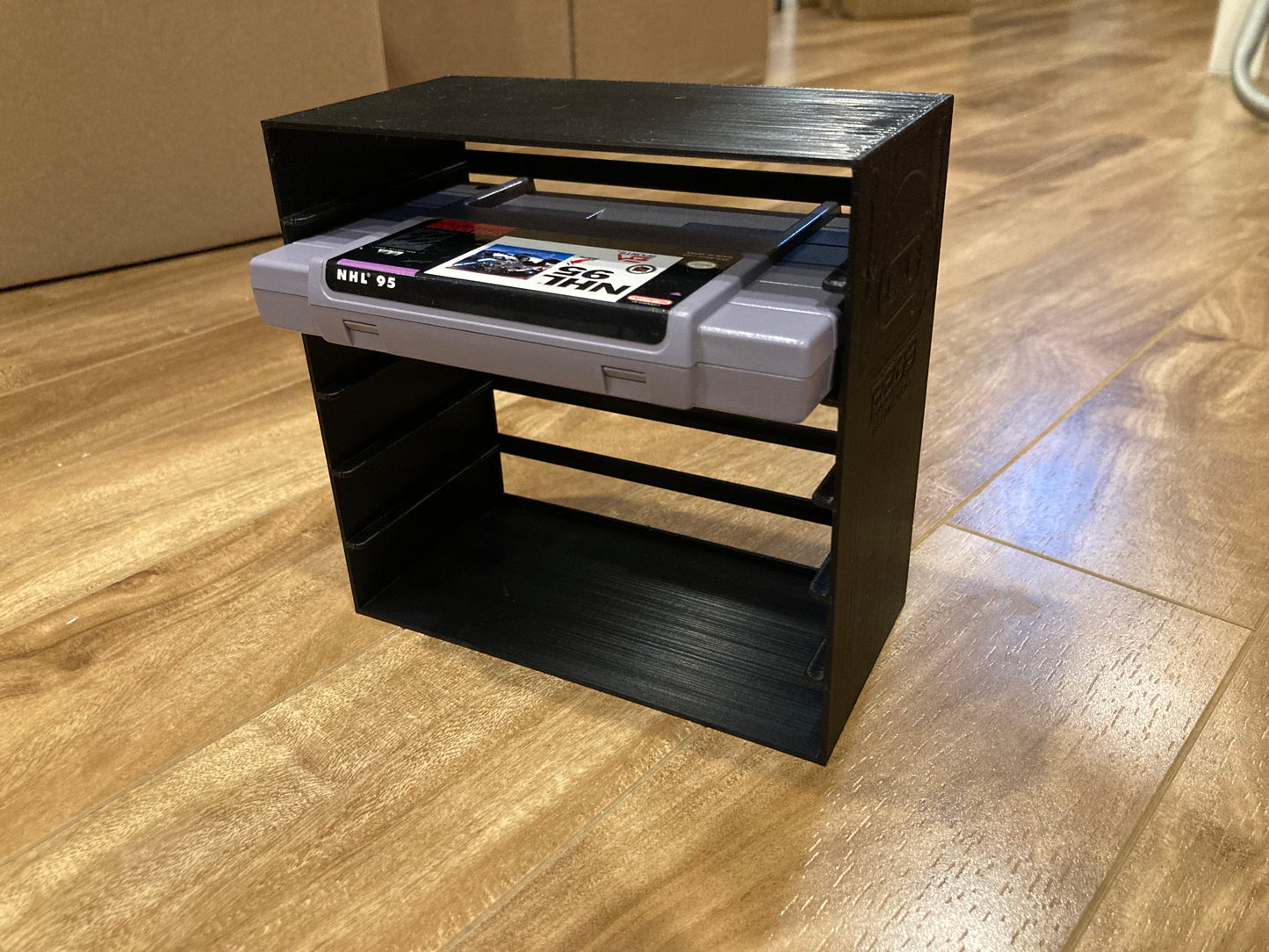 SNES rack display - Holds 6 games - Black color - Perfect condition