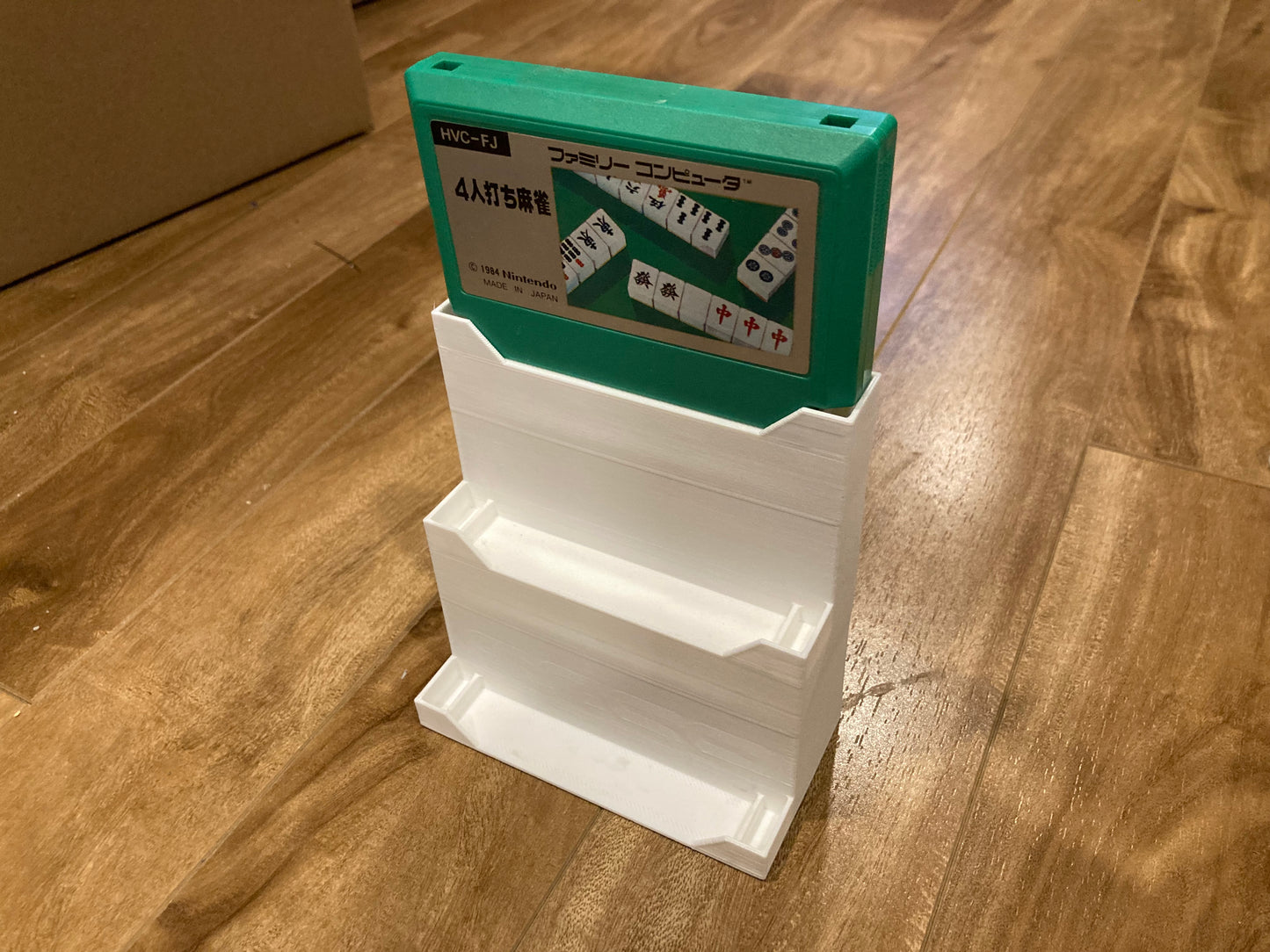 Famicom game display - Holds 3 games - White color - Perfect condition