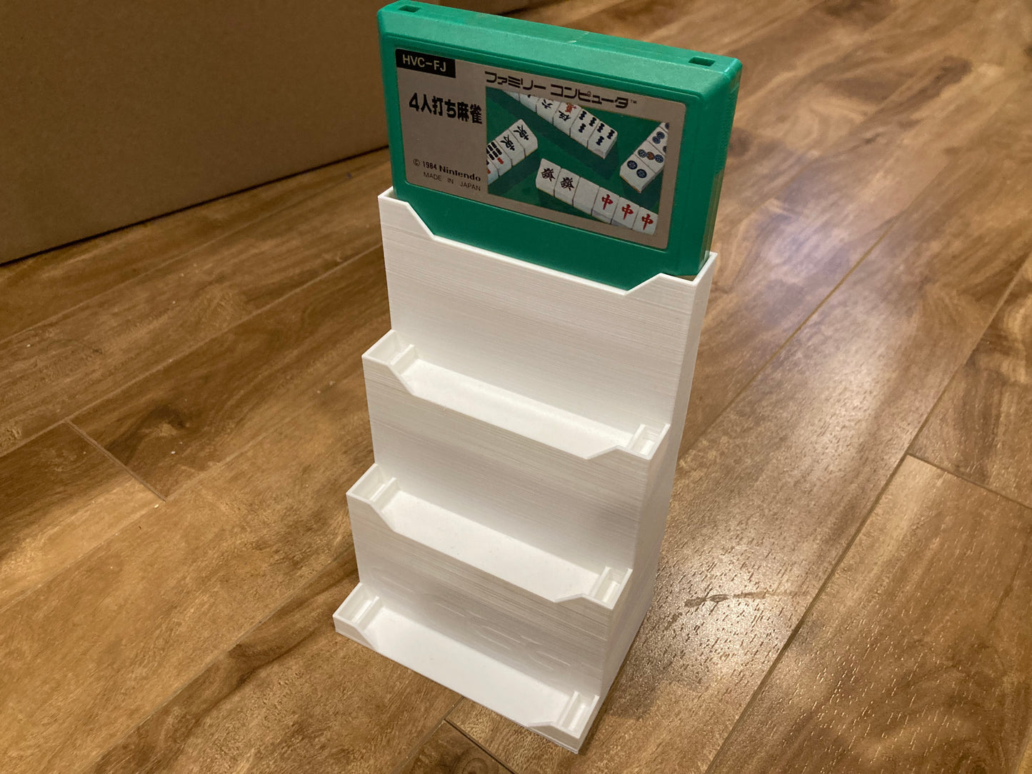 Famicom game display - Holds 4 games - White color - Perfect condition