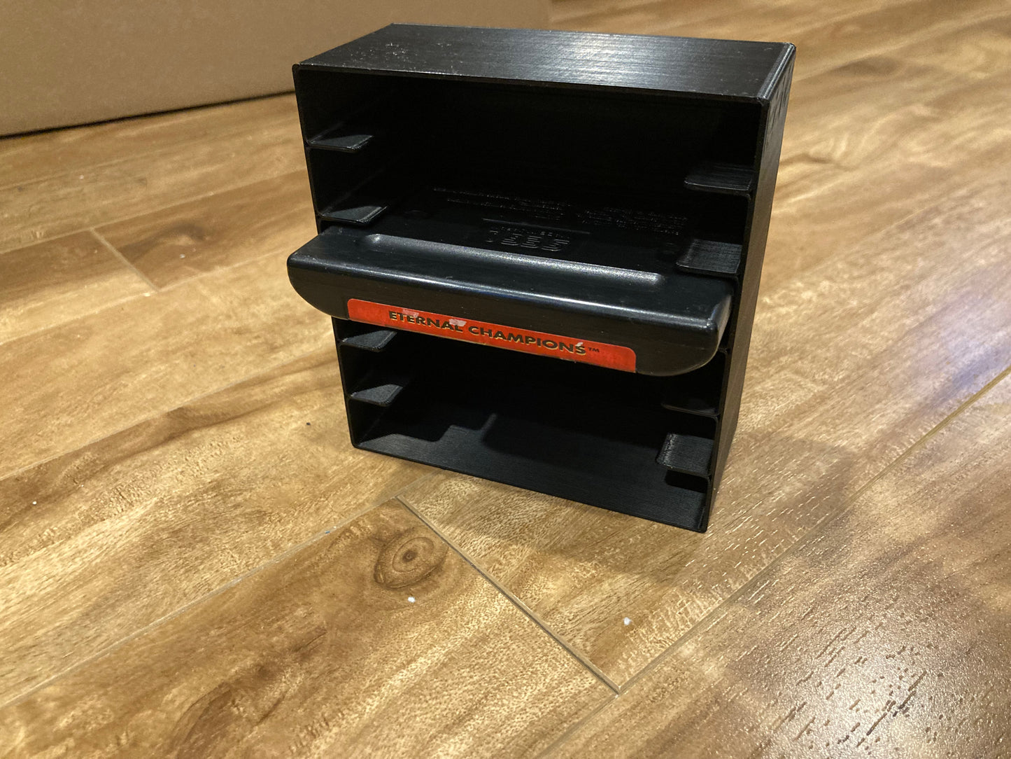 Sega Genesis rack display - Hold 6 games - Closed back - Black color - Perfect condition