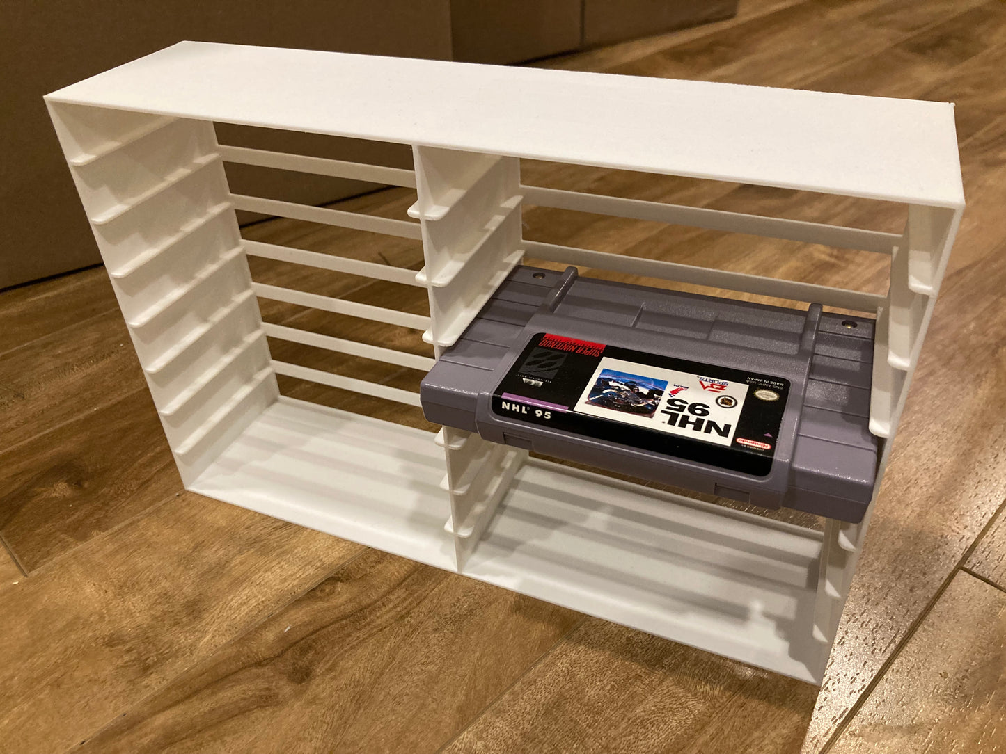 SNES rack display - Holds 16 games - White color - Perfect condition