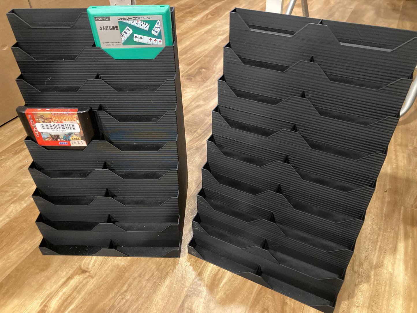 Set of 2 Genesis and/or Famicom game displays - Hold 18 games each - Black color - Slots are little too wide