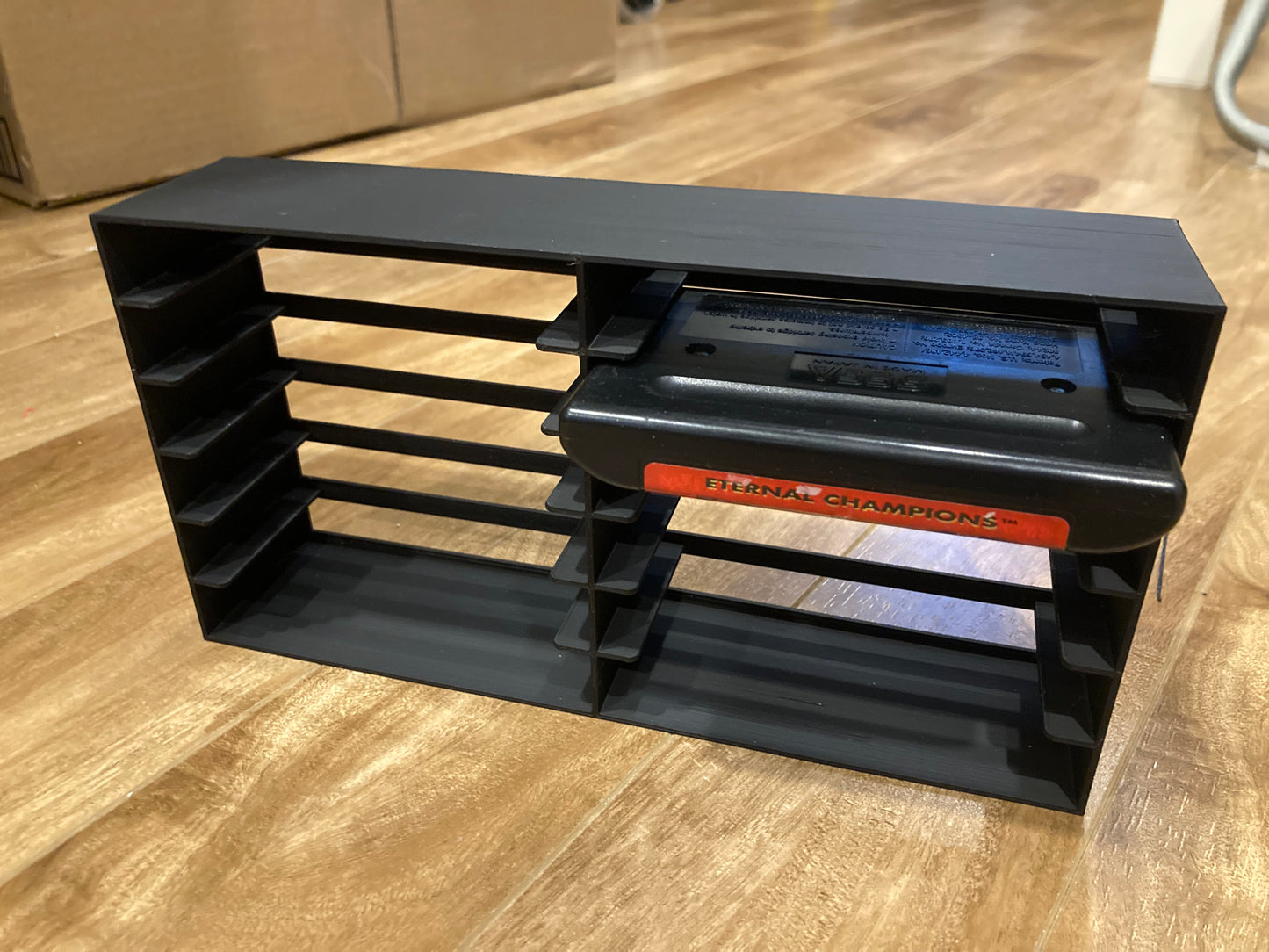 Sega Genesis rack display - Hold 12 games - Open back - Black color - Perfect condition