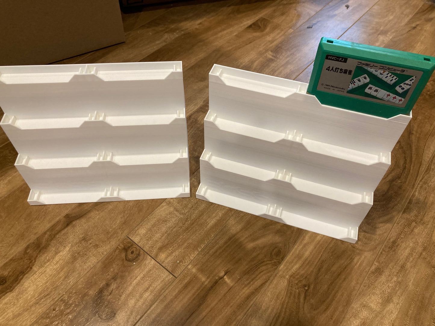 Set of 2 Famicom game displays - Hold 8 games each - White color - Perfect condition