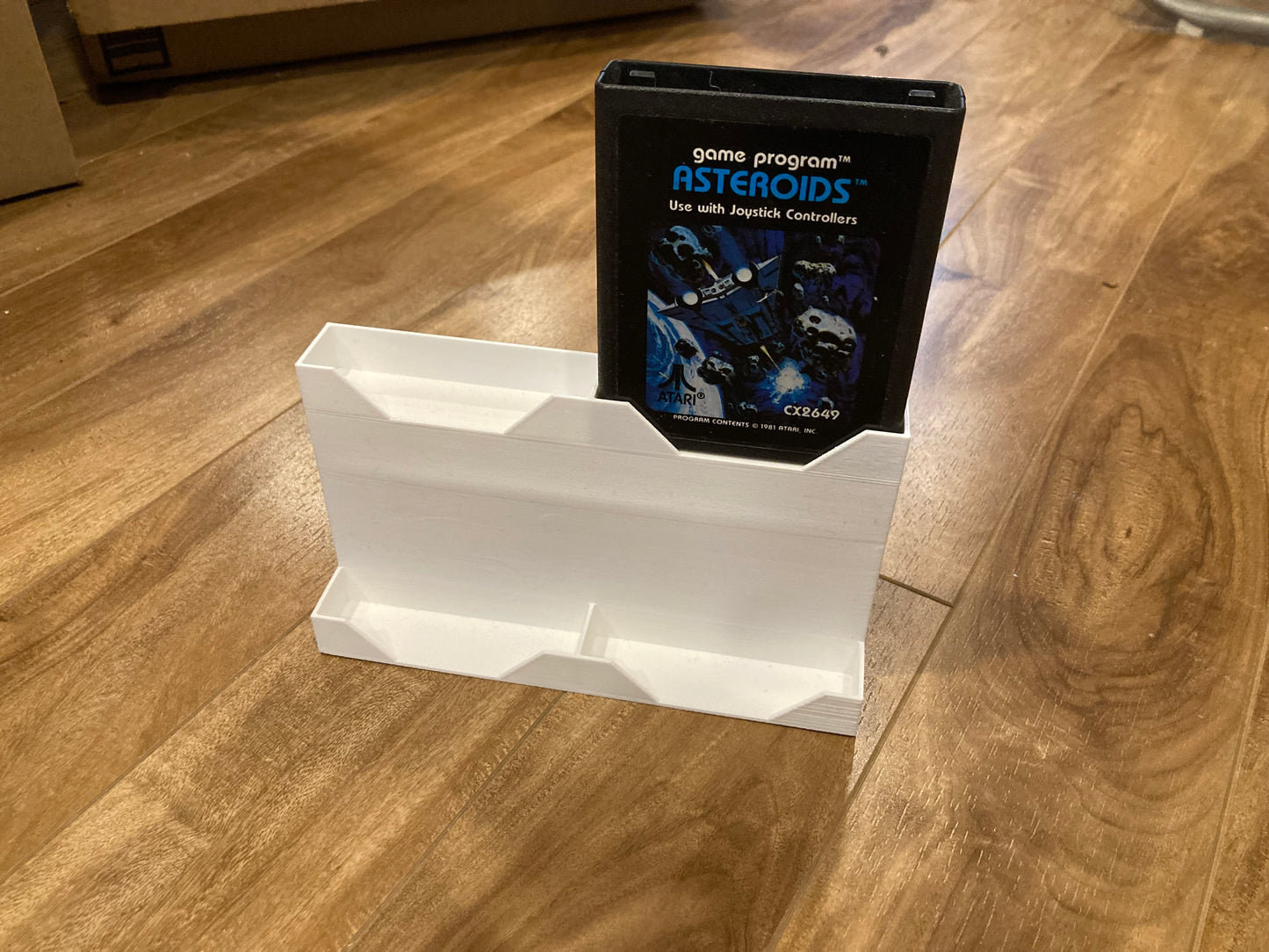 Atari 2600 game display - Holds 4 games - White color - Perfect condition