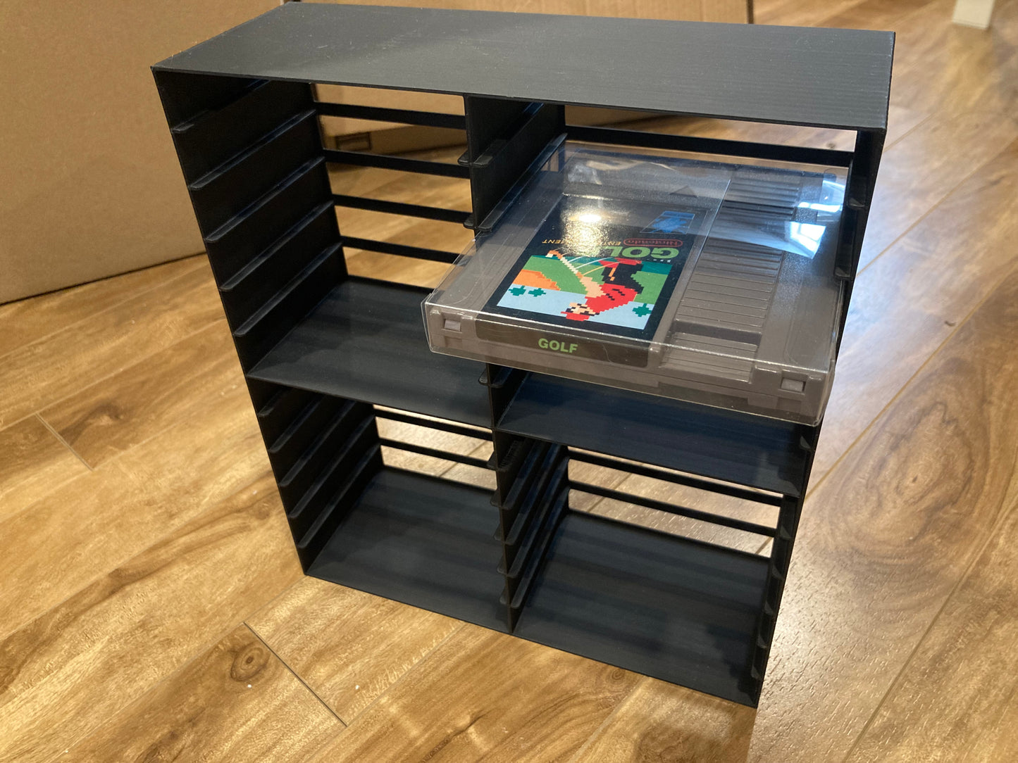 NES rack display for games in plastic PET protectors - Holds 24 games - Black color - Perfect condition