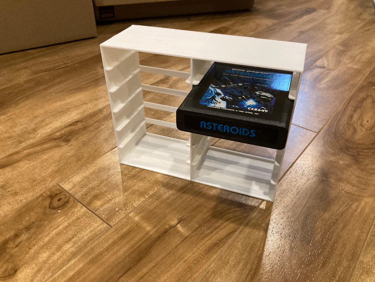 Atari 2600 game display - Holds 12 games - White color - Perfect condition