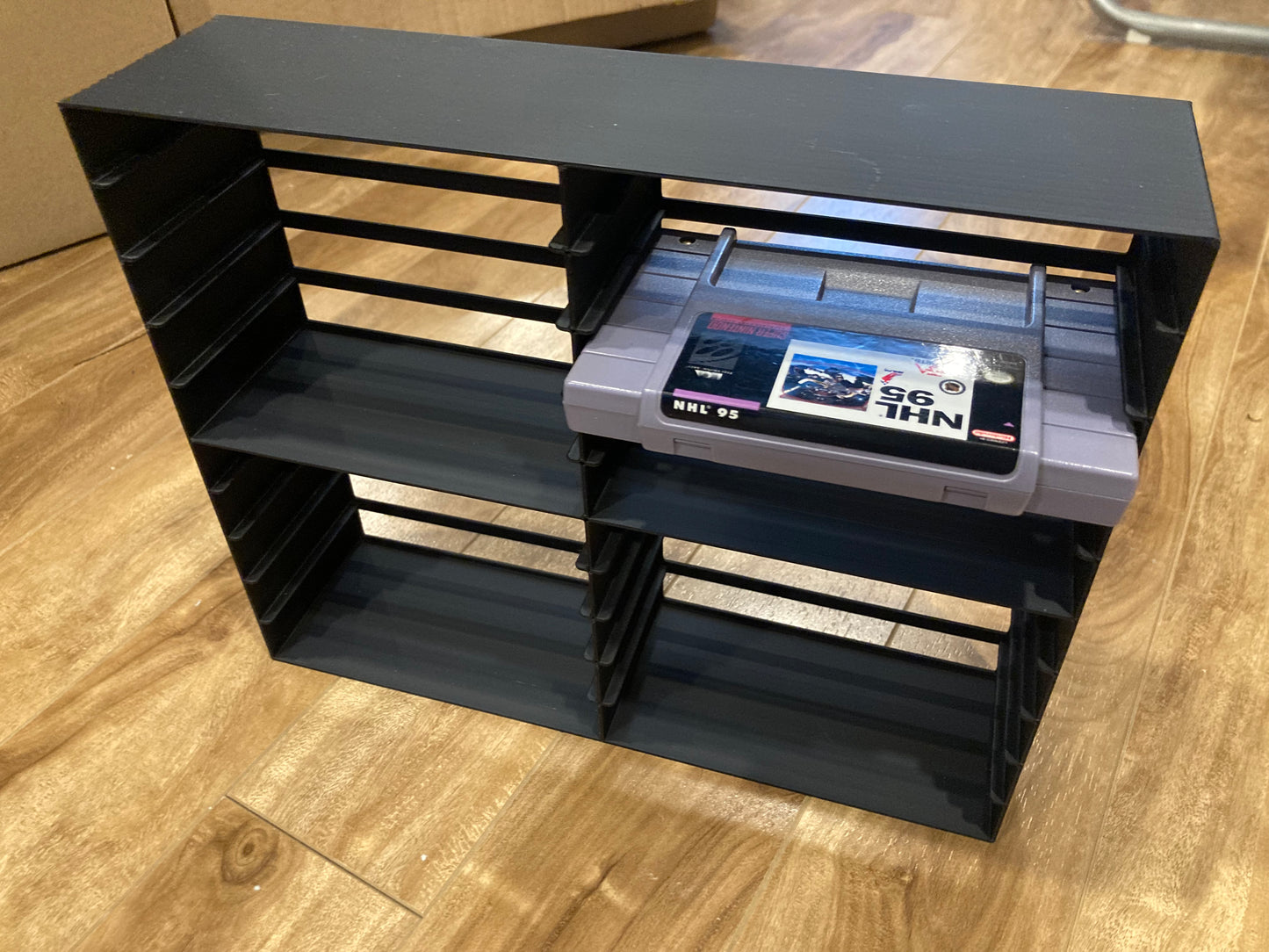 SNES rack display - Holds 20 games - Black color - Perfect condition