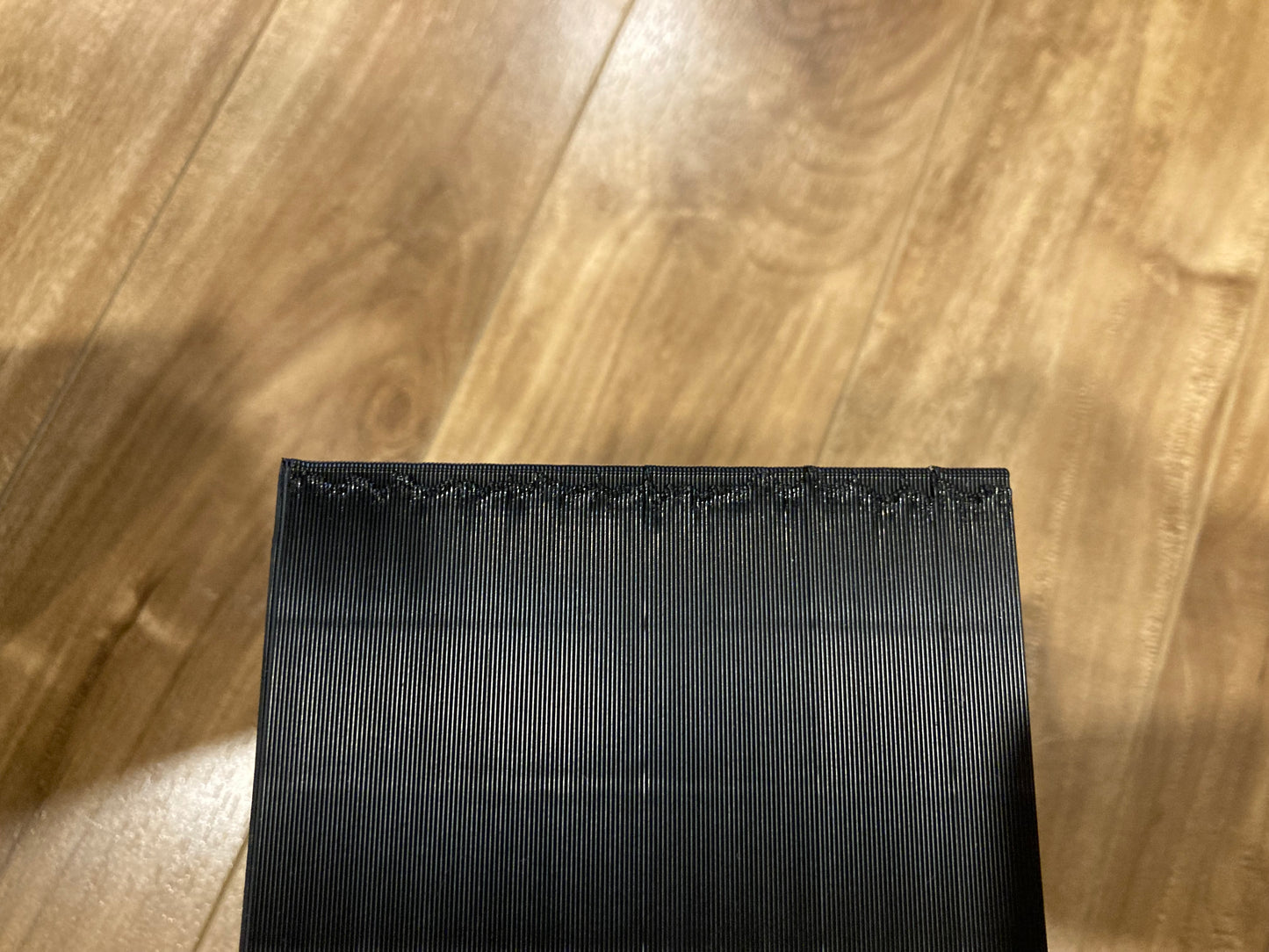 Set of 2 NES rack displays - Hold 15 games each - Closed back - Black color - Small imperfection in a corner