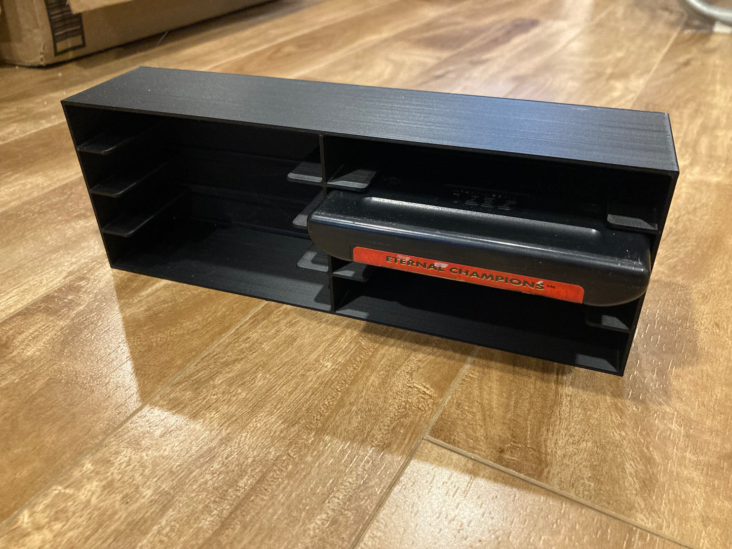 Sega Genesis game display - Holds 8 games - Closed back - Black color - perfect condition