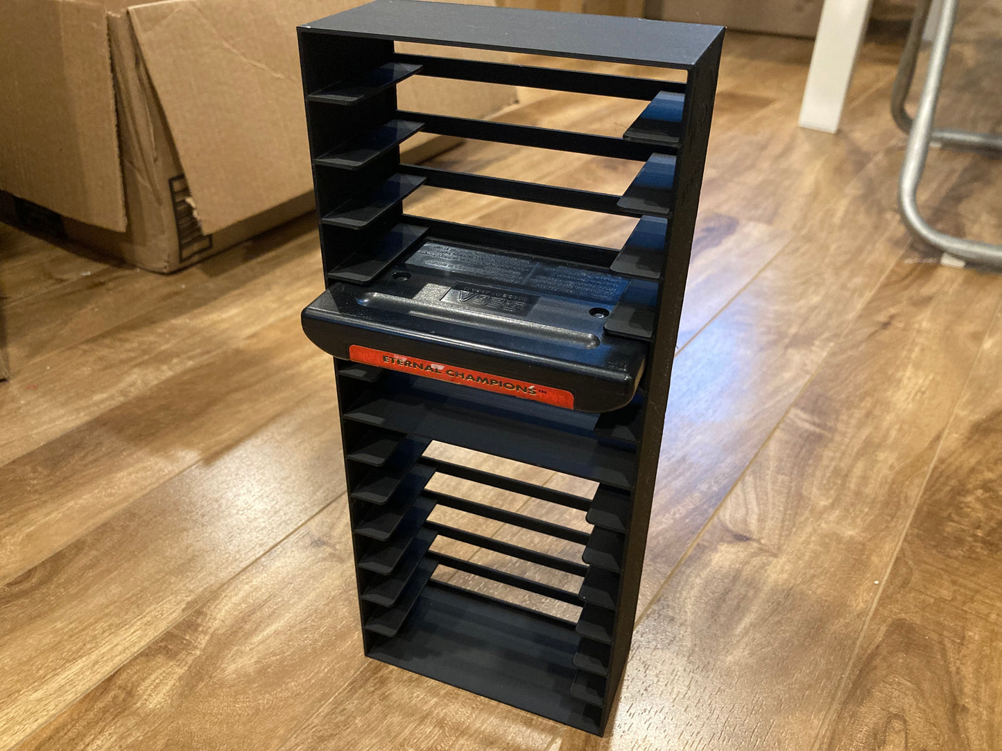 Sega Genesis rack display - Hold 14 games - Open back - Black color - Perfect condition