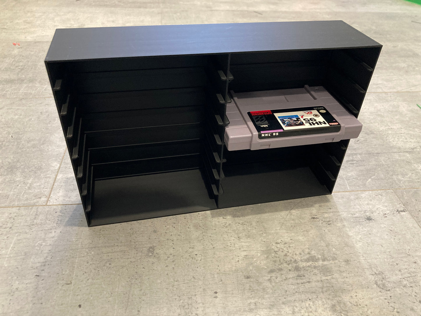 Rack display for 16 SNES games without protectors